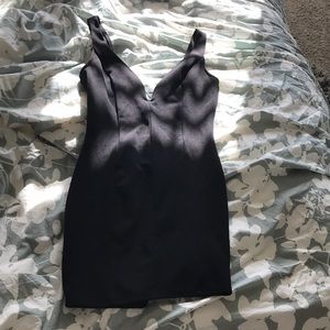 Plunging neckline black mini dress